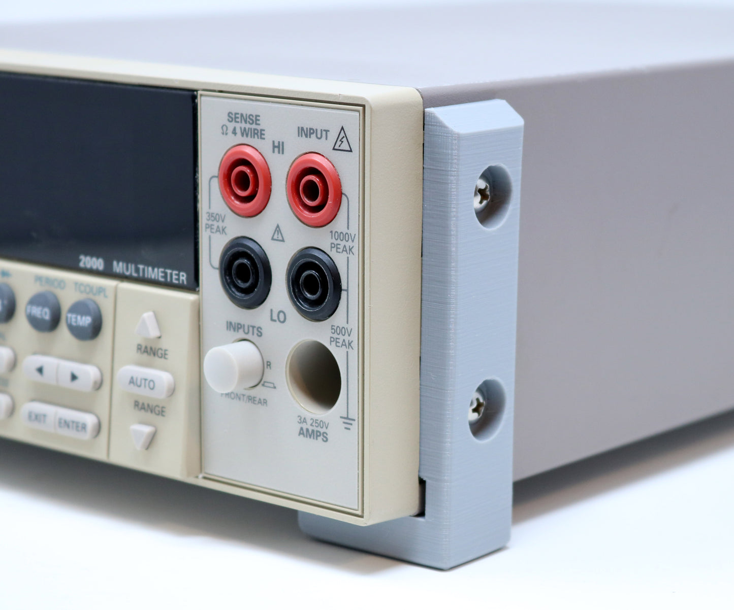 Multimeter with input jacks on a white background